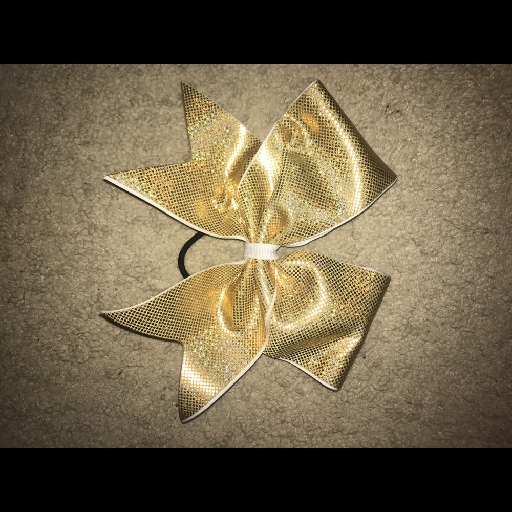 Gold cheer bow.